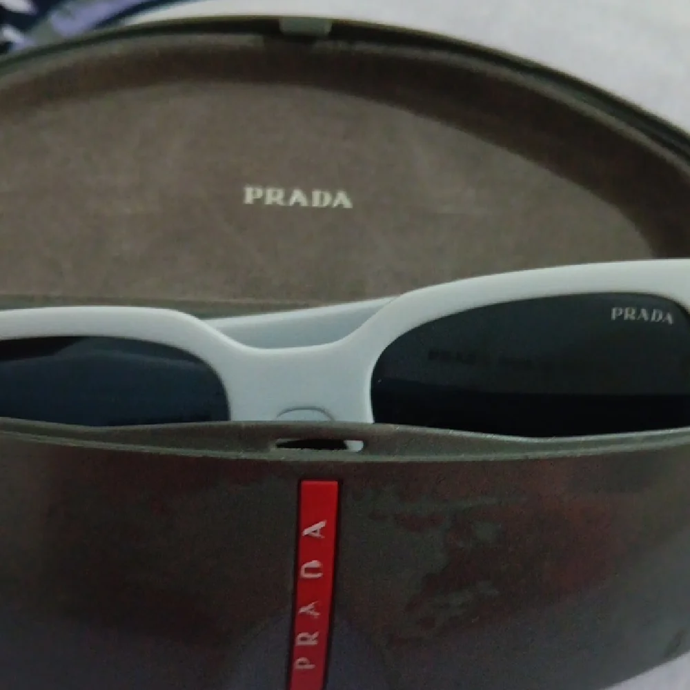 Prada Gray Sunglasses with Dark Lenses - Picture 10 of 10